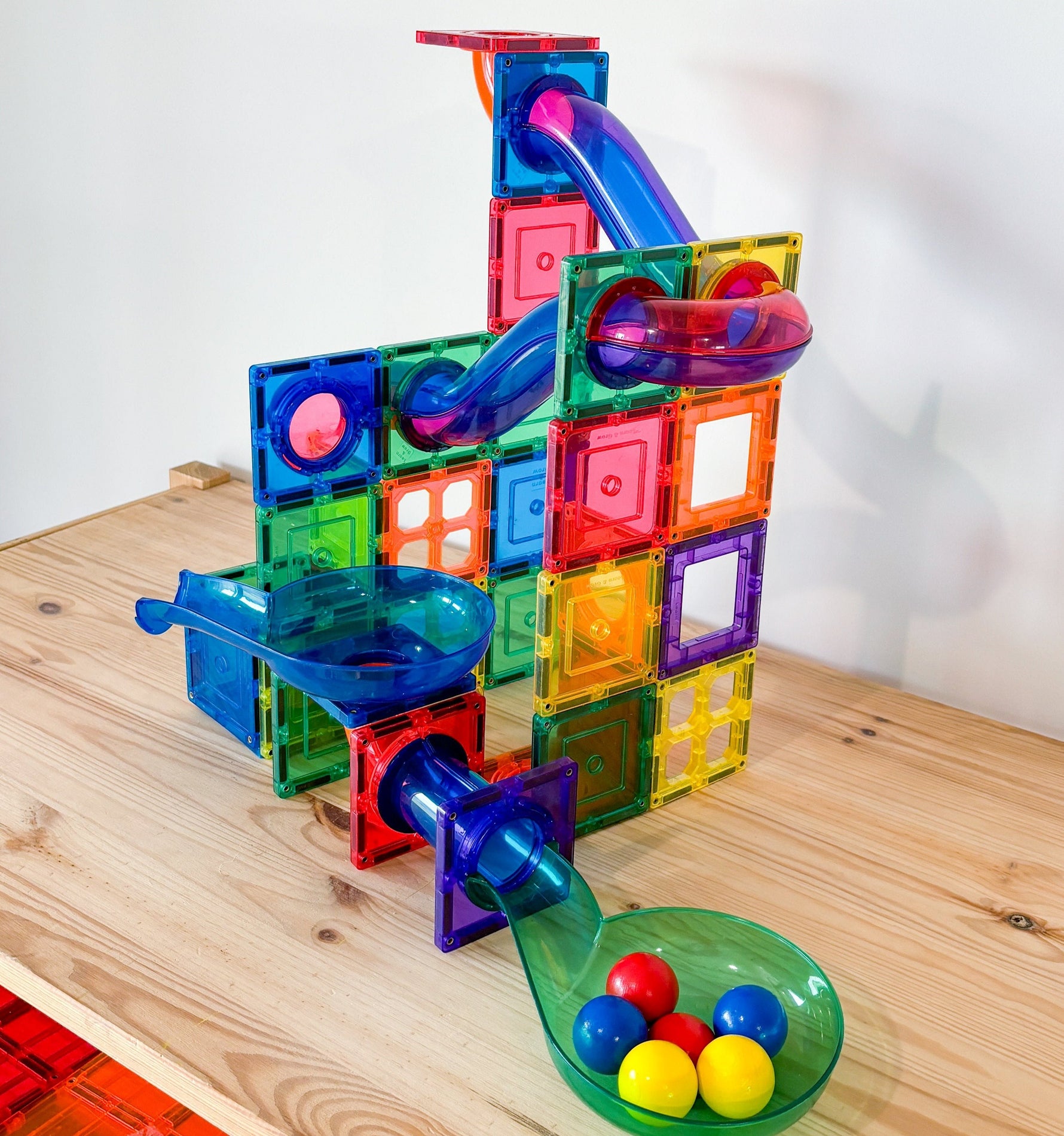 Colourful magnetic ball run set up on table