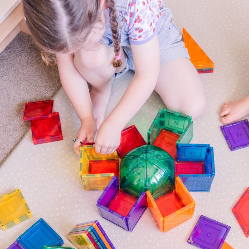 Child playing with squares and domes