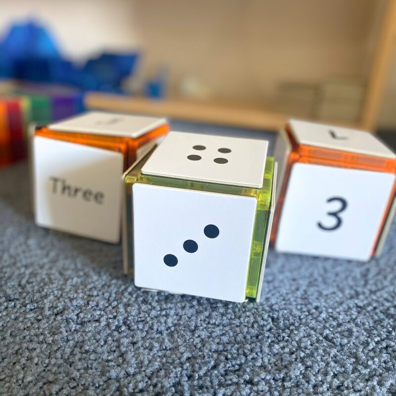 Numeracy toppers on a cube made from learn and grow toys magnetic tiles