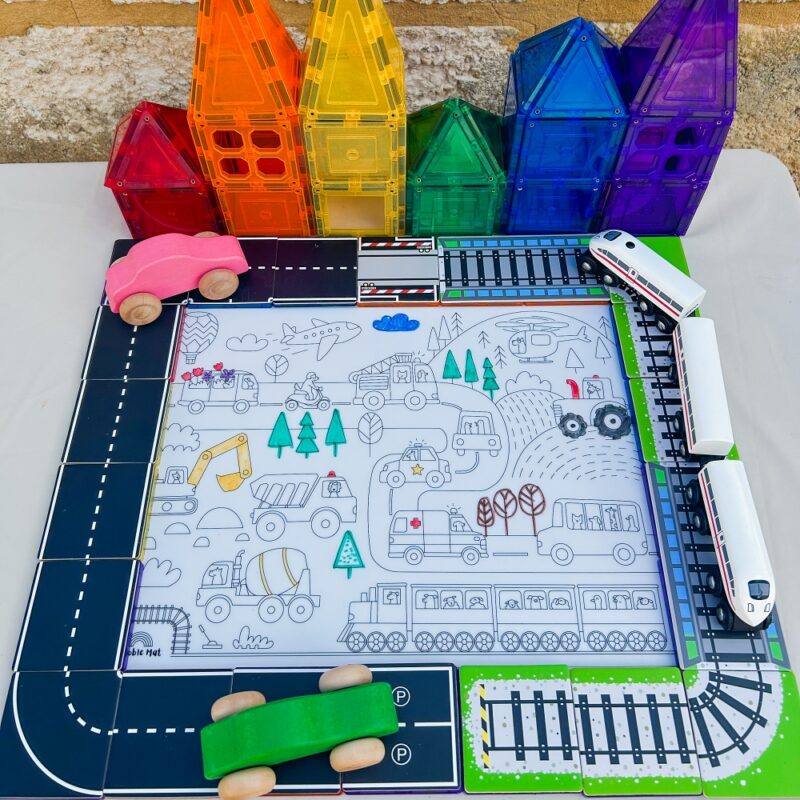 Road and train toppers with colourful magnetic houses and hey doodle mat in the middle