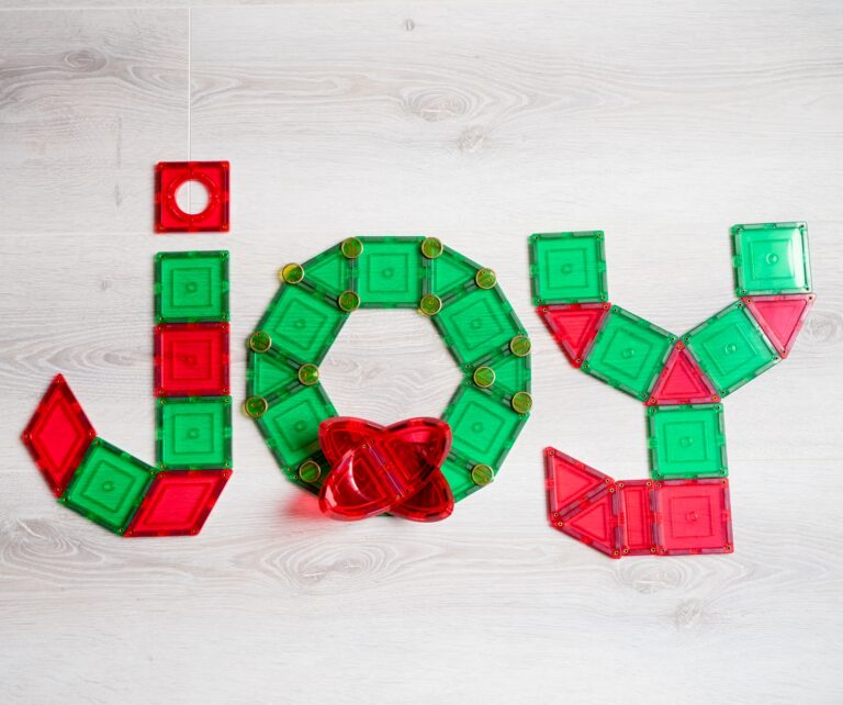 Joy spelt in learn and grow toys magnetic tiles - christmas 2023