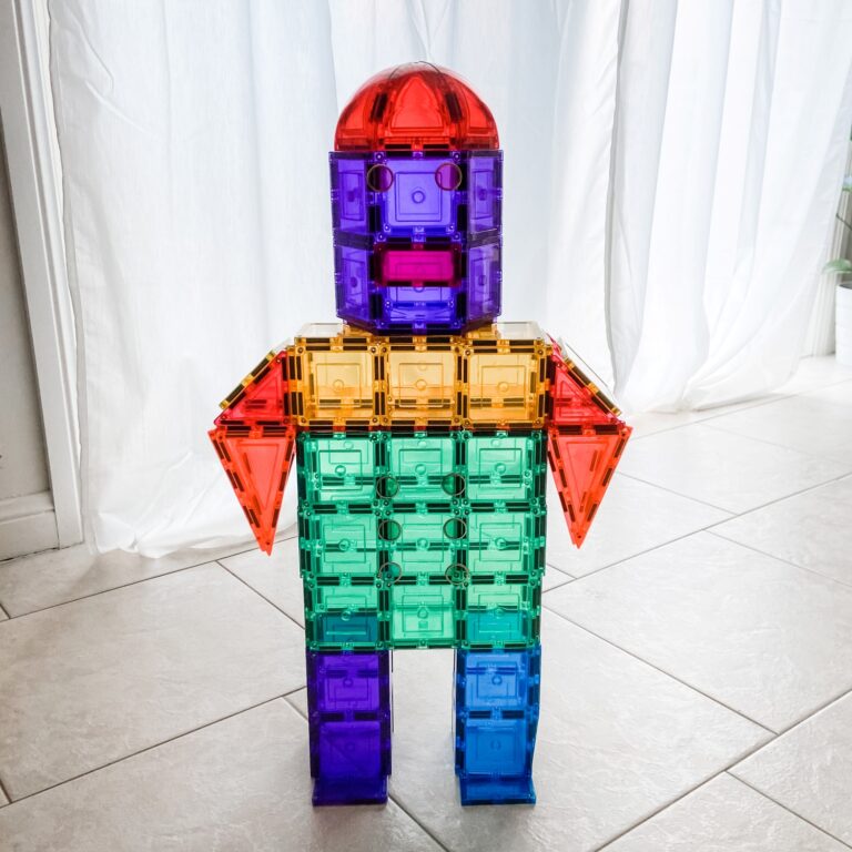 Large Rainbow Robot with light streaming into room through curtains