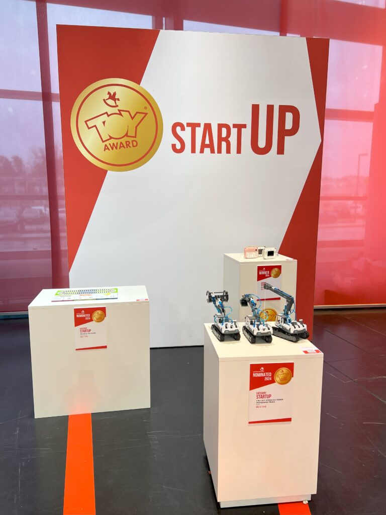 Learn & Grow Toy Award on pedestal with other nominees- Startup category Spielwarenmesse 2024